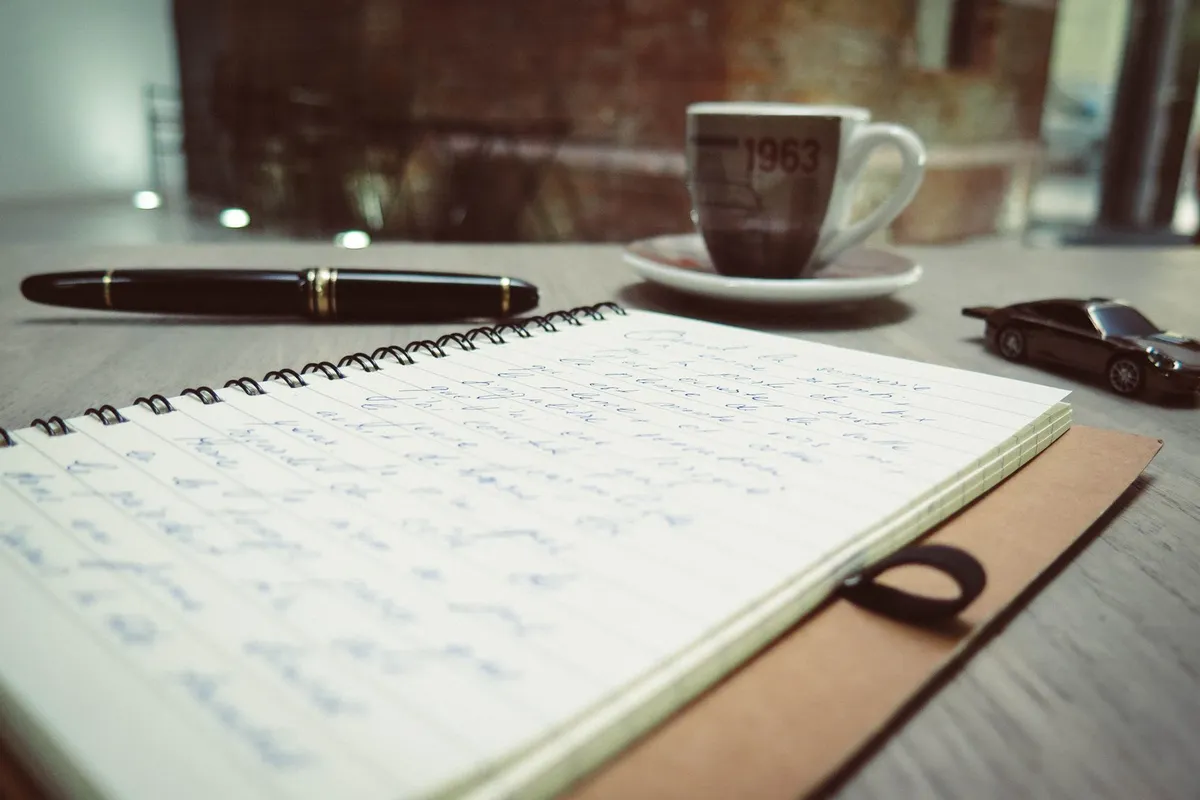 A notebook and pen on a desk, ready for an honest list about your own half