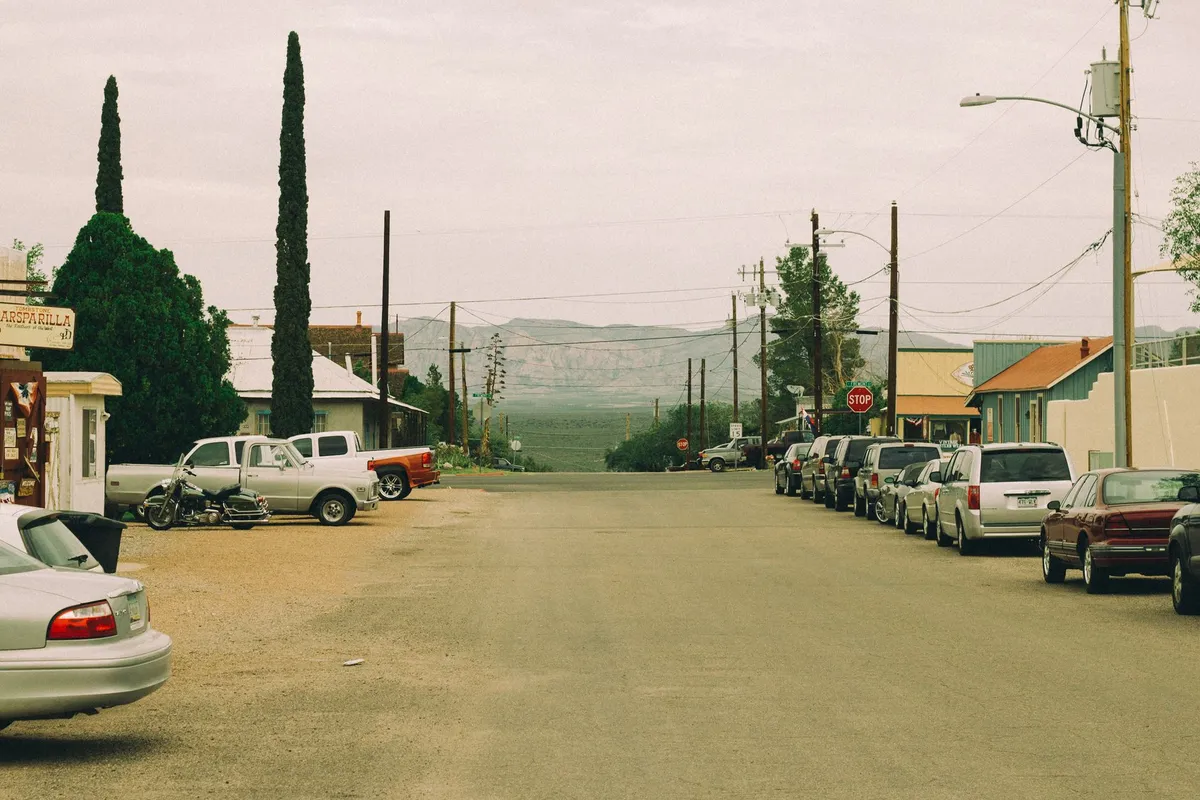 An empty rural road, the reality of searching for porn addiction counseling near me in a small town