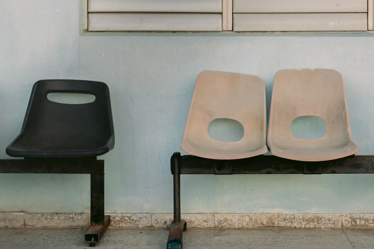 Two chairs facing each other in a quiet counseling room with natural light