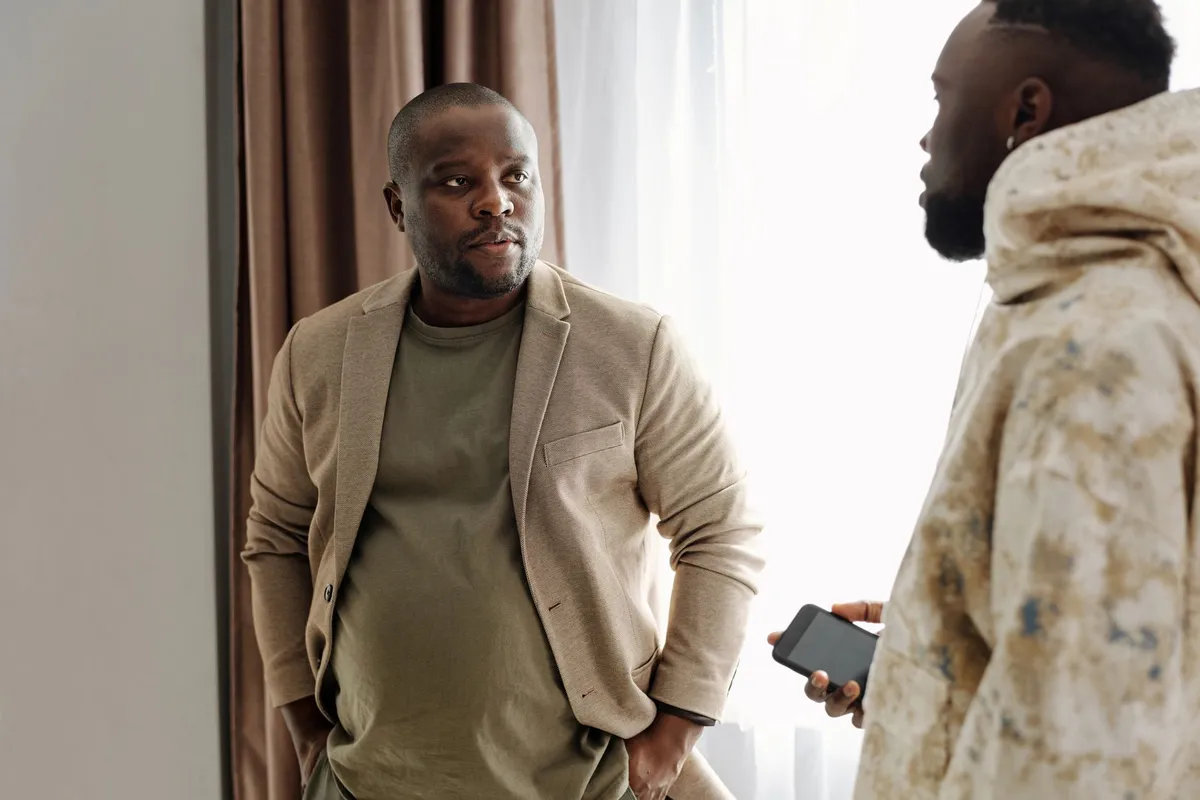 Two men in a counseling session having a serious conversation