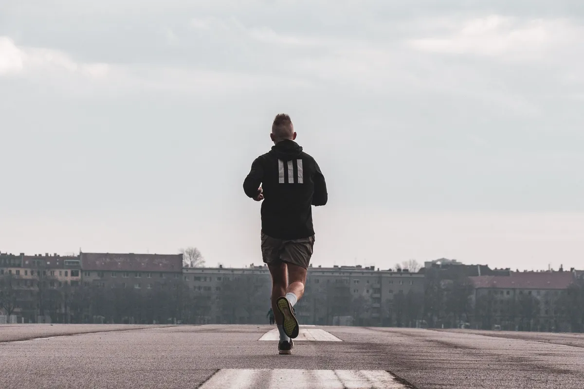 A man running outdoors in the early morning