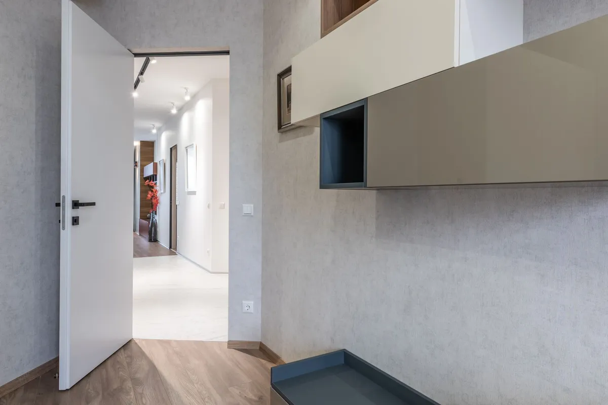 An open door onto an empty hallway, the question of whether to leave a toxic marriage